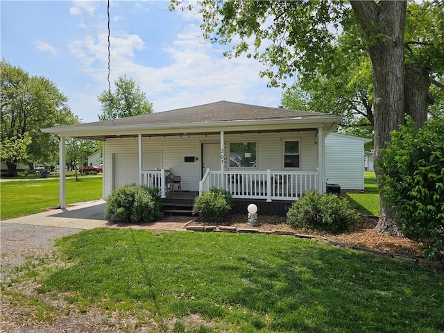 view of front facade featuring covered porch, a front lawn, a garage, driveway, and central air condition unit