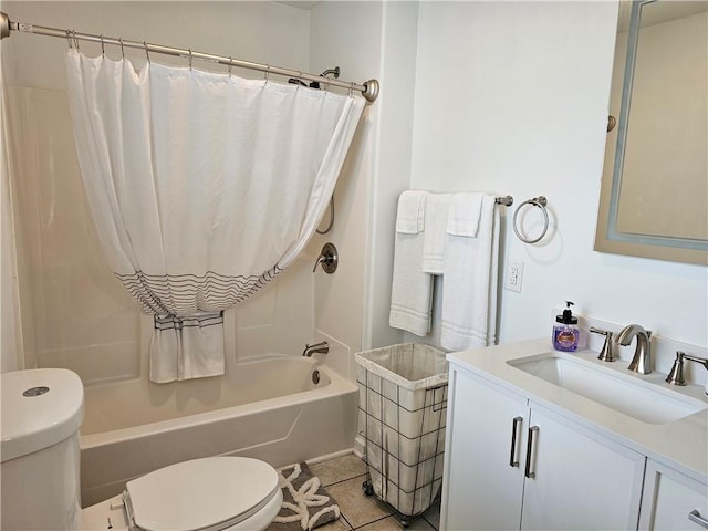 full bath with toilet, shower / tub combo, tile patterned flooring, and vanity