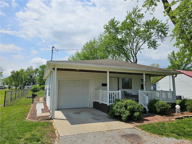 view of front of home with driveway, a porch, and a garage