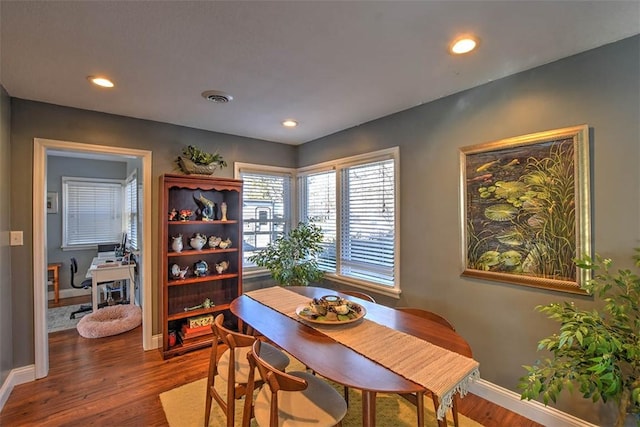 dining room with dark hardwood / wood-style floors