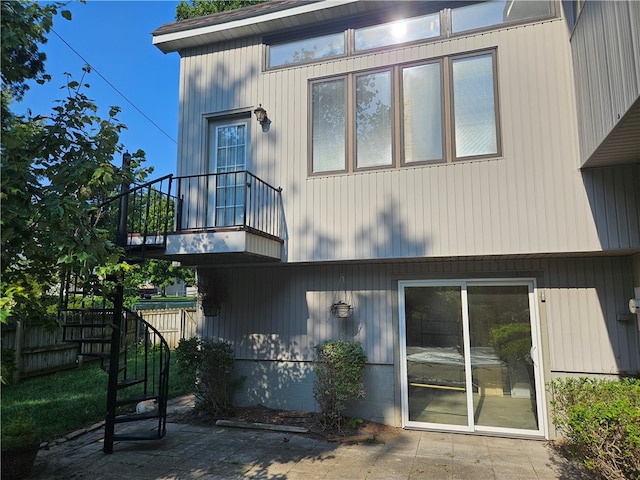 rear view of house featuring a balcony