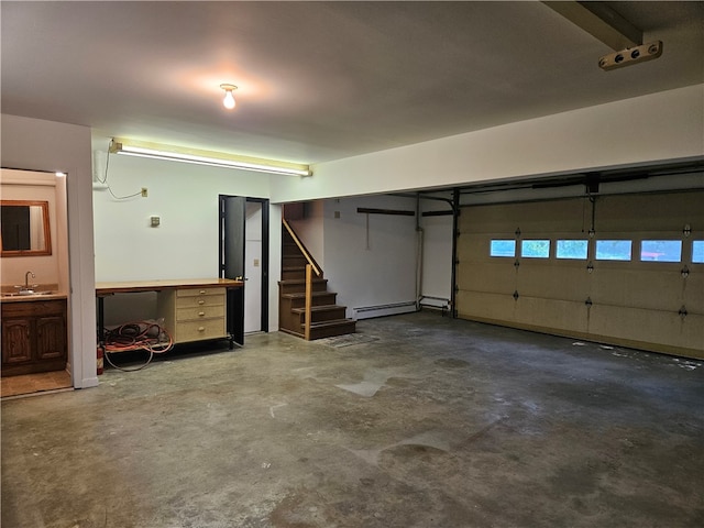 garage with sink and a baseboard heating unit