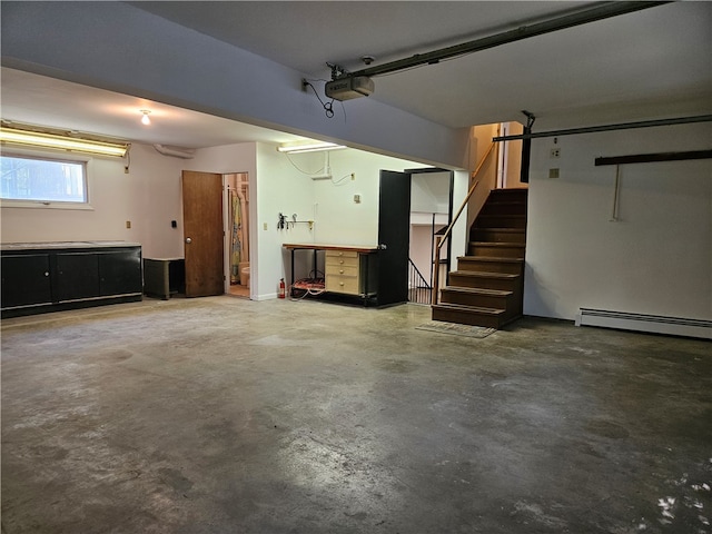 garage with baseboard heating and a garage door opener