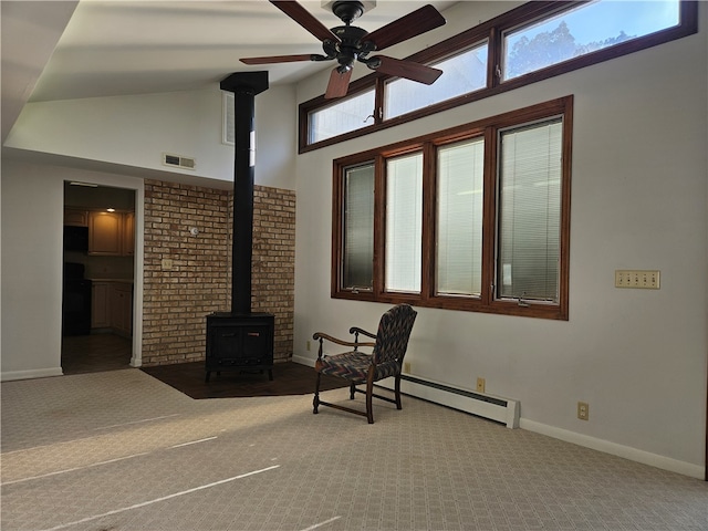 view of patio / terrace with baseboard heating and ceiling fan