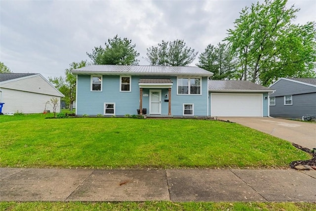 3531 Fontenac Dr, Decatur, IL 62521 - bi-level home with a garage, metal roof, and a front lawn