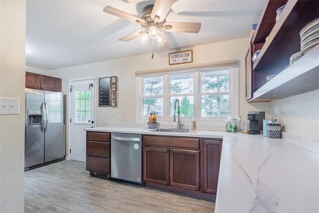 3531 Fontenac Dr, Decatur, IL 62521 - kitchen with open shelves, a sink, a ceiling fan, light wood-style flooring, and appliances with stainless steel finishes