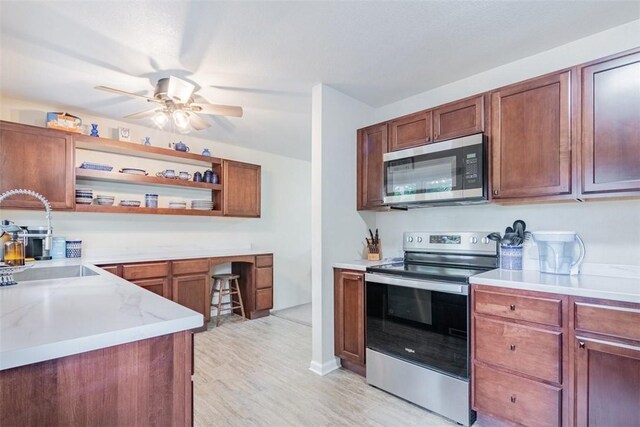 3531 Fontenac Dr, Decatur, IL 62521 - kitchen featuring open shelves, light wood-style floors, ceiling fan, a sink, and stainless steel appliances