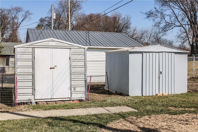 view of shed with fence