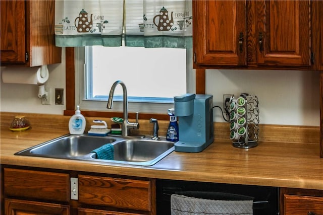 kitchen with a sink and wood counters