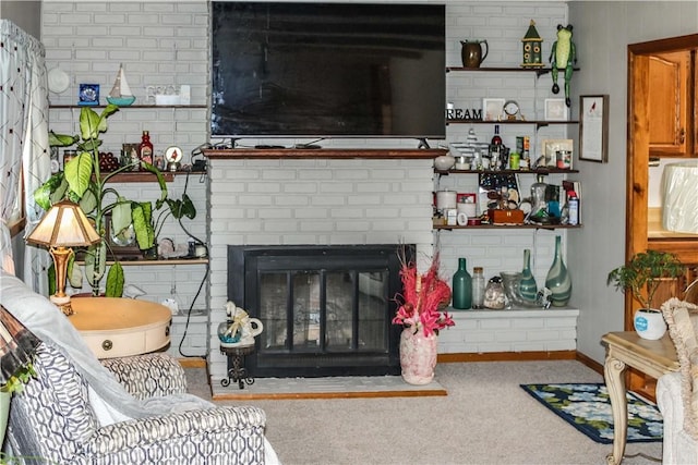 living room featuring a fireplace, baseboards, and carpet floors