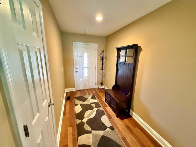 entryway with recessed lighting, light wood-type flooring, and baseboards