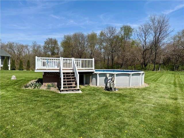 outdoor pool with stairway, a deck, and a lawn