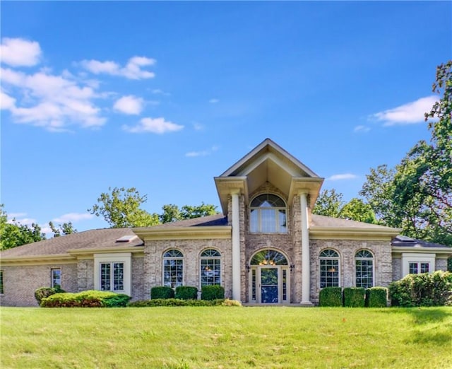 6086 Chicory Knl, Charleston, IL 61920 - neoclassical home featuring a front lawn and french doors