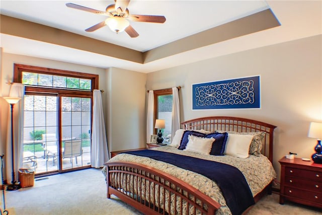 6086 Chicory Knl, Charleston, IL 61920 - carpeted bedroom with access to outside, multiple windows, and ceiling fan