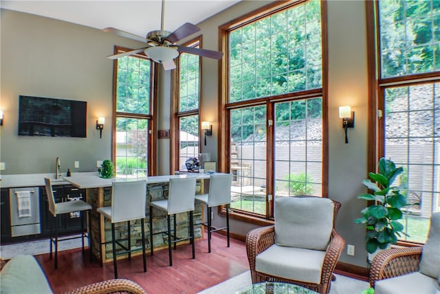 6086 Chicory Knl, Charleston, IL 61920 - kitchen featuring ceiling fan, wood finished floors, beverage cooler, and a towering ceiling
