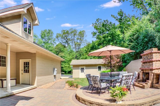 6086 Chicory Knl, Charleston, IL 61920 - view of patio / terrace with an outdoor fireplace and outdoor dining space