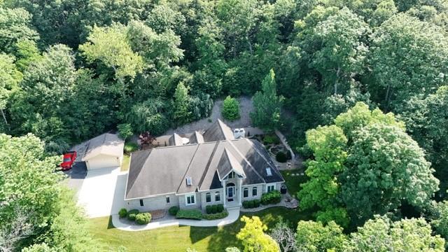 6086 Chicory Knl, Charleston, IL 61920 - view of subject property featuring a heavily wooded area