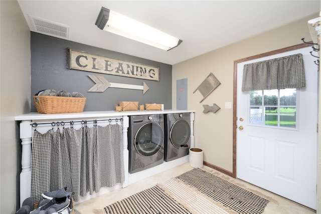 washroom with independent washer and dryer and electric panel