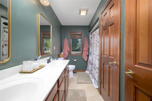 carpeted bedroom with a tray ceiling, ceiling fan, and ornamental molding