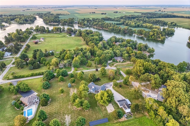 birds eye view of property with a water view and a rural view