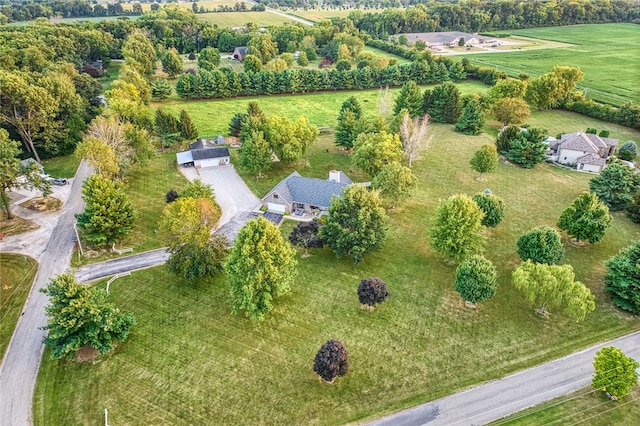 birds eye view of property with a rural view