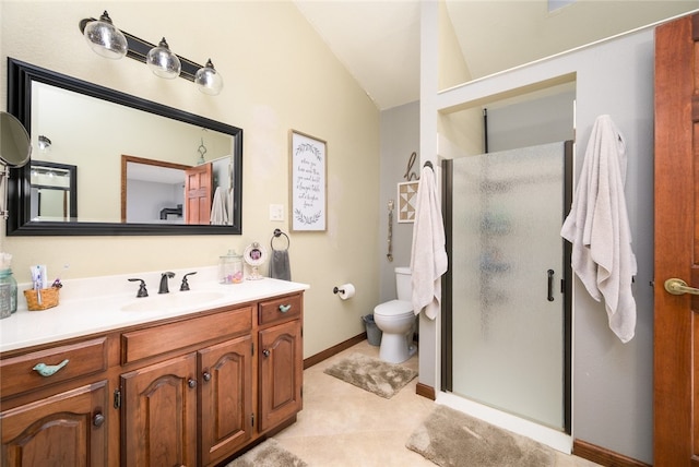 bathroom with tile patterned floors, lofted ceiling, toilet, a shower with door, and vanity