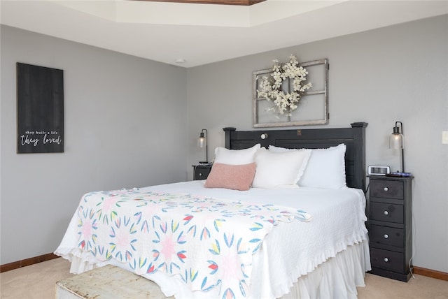 bedroom featuring light carpet