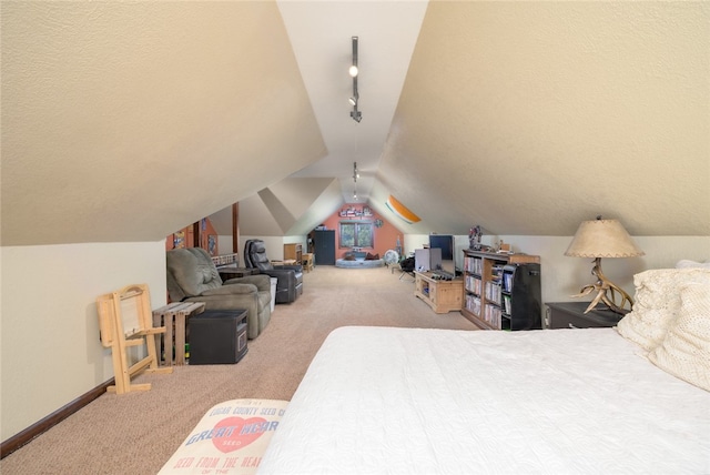 bedroom featuring carpet and lofted ceiling