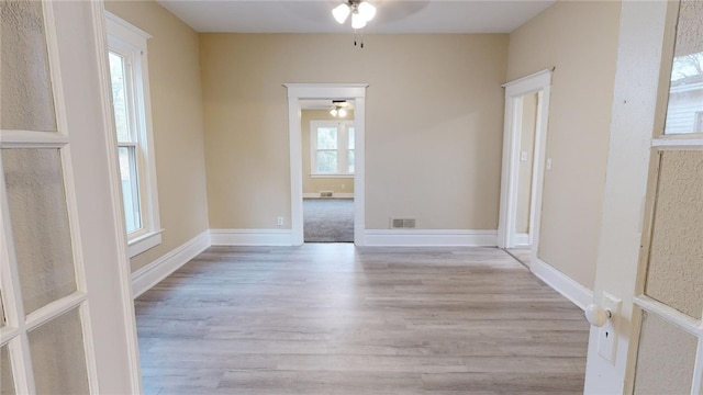 spare room featuring ceiling fan and light hardwood / wood-style floors