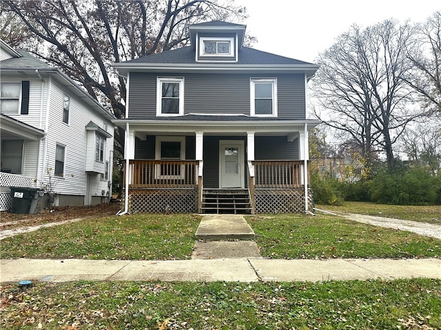 front of property featuring a porch and a front yard