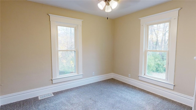 unfurnished room featuring carpet floors and ceiling fan