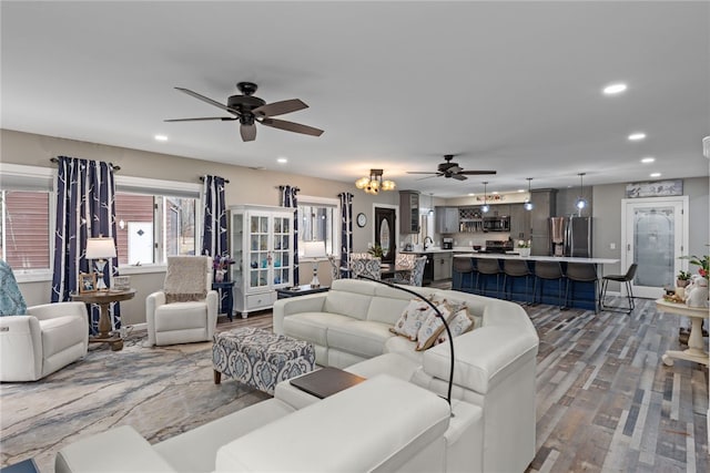 living room with hardwood / wood-style flooring and ceiling fan