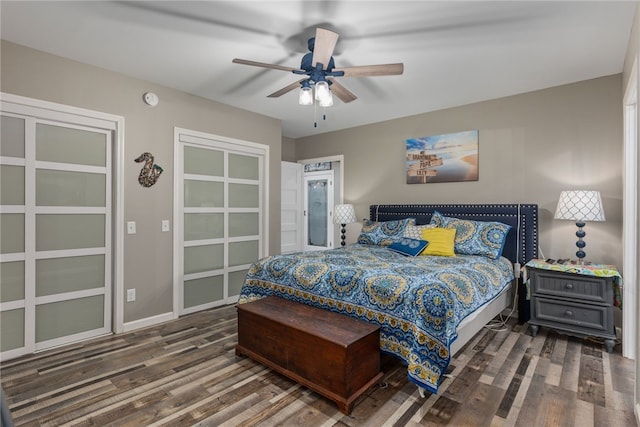 bedroom with dark wood-type flooring and ceiling fan