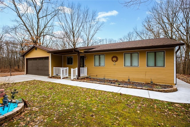 ranch-style home with a garage and a front yard