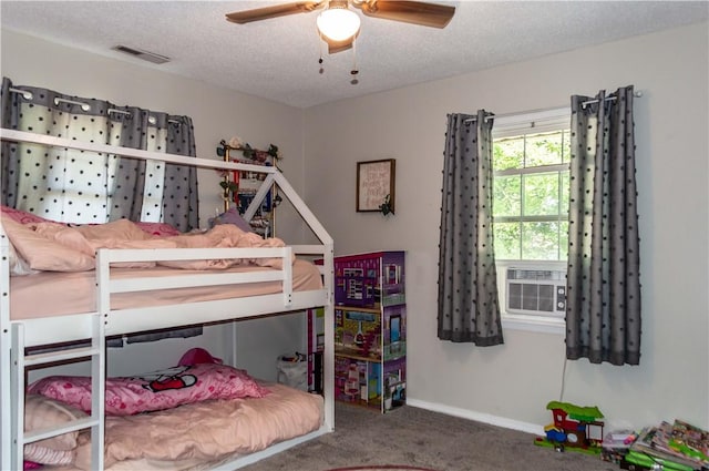 317 Hickory Ln, Mattoon, IL 61938 - carpeted bedroom with cooling unit, a textured ceiling, and a ceiling fan