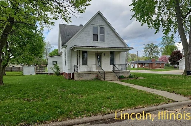 1102 3rd St, Lincoln, IL 62656 - bungalow featuring covered porch and a front yard