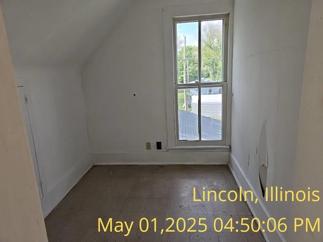 1102 3rd St, Lincoln, IL 62656 - additional living space featuring lofted ceiling and baseboards
