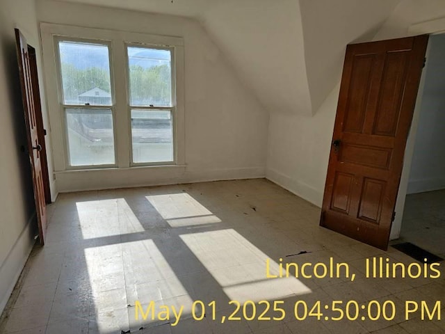 1102 3rd St, Lincoln, IL 62656 - bonus room with vaulted ceiling and baseboards