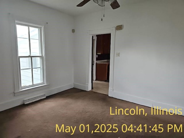 1102 3rd St, Lincoln, IL 62656 - unfurnished room featuring carpet flooring, a ceiling fan, and baseboards