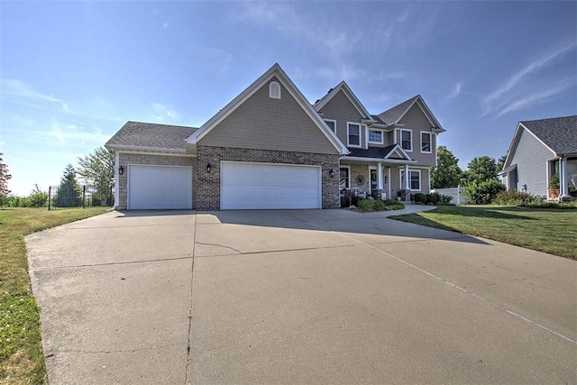 1008 Schroll Dr, Forsyth, IL 62535 - view of front facade with driveway, a garage, a front yard, and brick siding