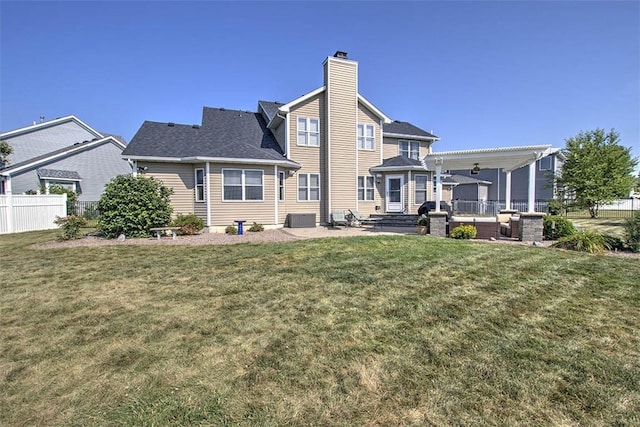 1008 Schroll Dr, Forsyth, IL 62535 - rear view of house featuring a chimney and a patio