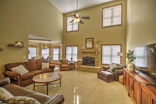 1008 Schroll Dr, Forsyth, IL 62535 - living room featuring a high ceiling, a chandelier, carpet flooring, a fireplace, and ceiling fan