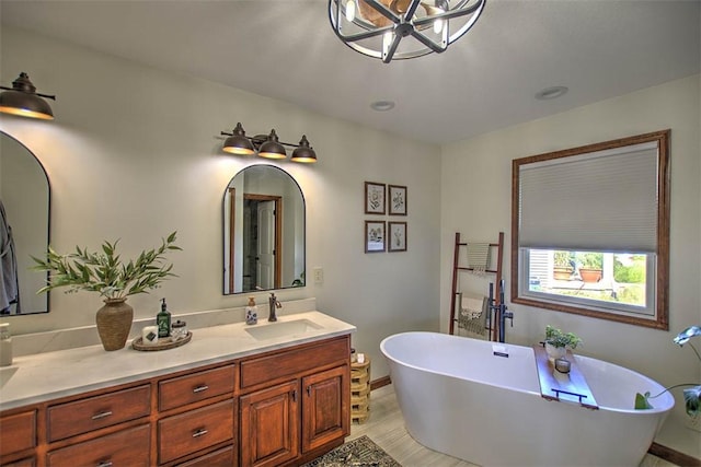 1008 Schroll Dr, Forsyth, IL 62535 - full bathroom with double vanity and a freestanding tub