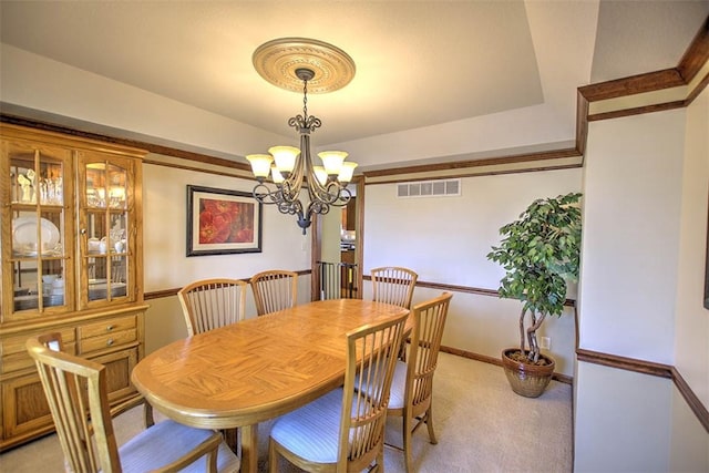 1008 Schroll Dr, Forsyth, IL 62535 - dining space featuring light colored carpet, a chandelier, and a raised ceiling