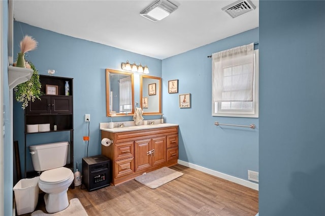 22417 N 1320th St, Marshall, IL 62441 - bathroom with wood finished floors, toilet, vanity, and baseboards