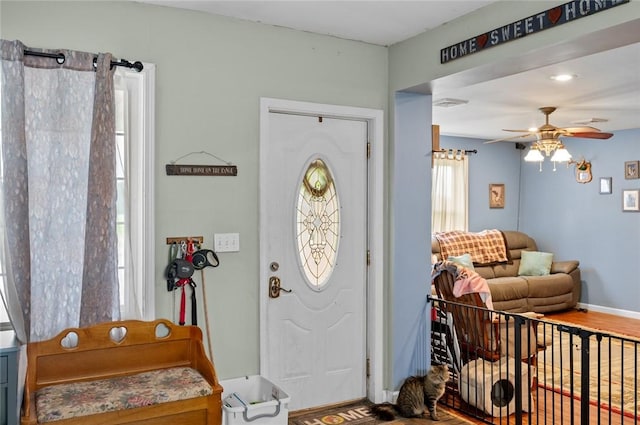 22417 N 1320th St, Marshall, IL 62441 - entryway featuring a ceiling fan, wood finished floors, and baseboards