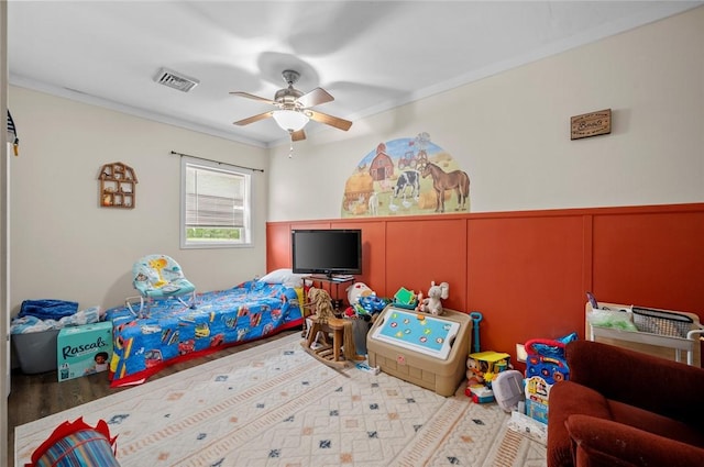 22417 N 1320th St, Marshall, IL 62441 - bedroom featuring a decorative wall, wainscoting, ornamental molding, and a ceiling fan