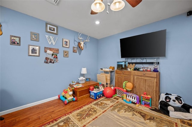 22417 N 1320th St, Marshall, IL 62441 - rec room with a ceiling fan, wood finished floors, baseboards, and recessed lighting