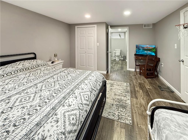 bedroom with recessed lighting, wood finished floors, visible vents, and baseboards