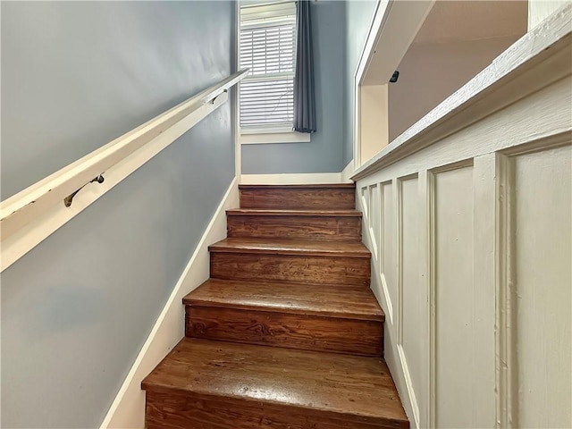 staircase featuring wood finished floors